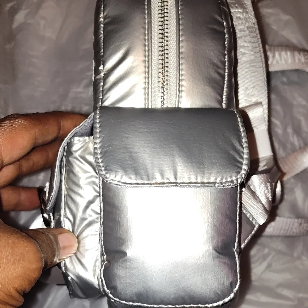 Steve Madden Silver Backpack. Front and side pockets.